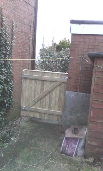 Gate secured with padlock bolt