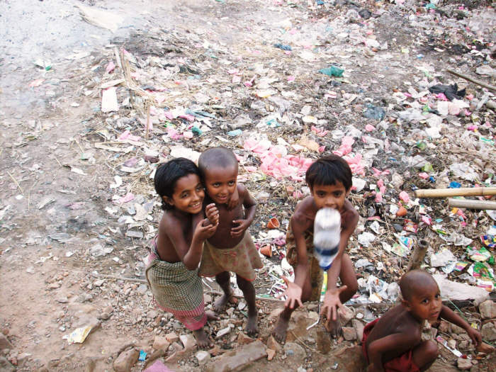 These are the children who are orphans, in Narsingdi, Bangladesh, who beg on the streets. They seem so happy, but the suffering and abuse is beyond imagination. I took this picture on the bus, and they were looking up at me begging for food and money.