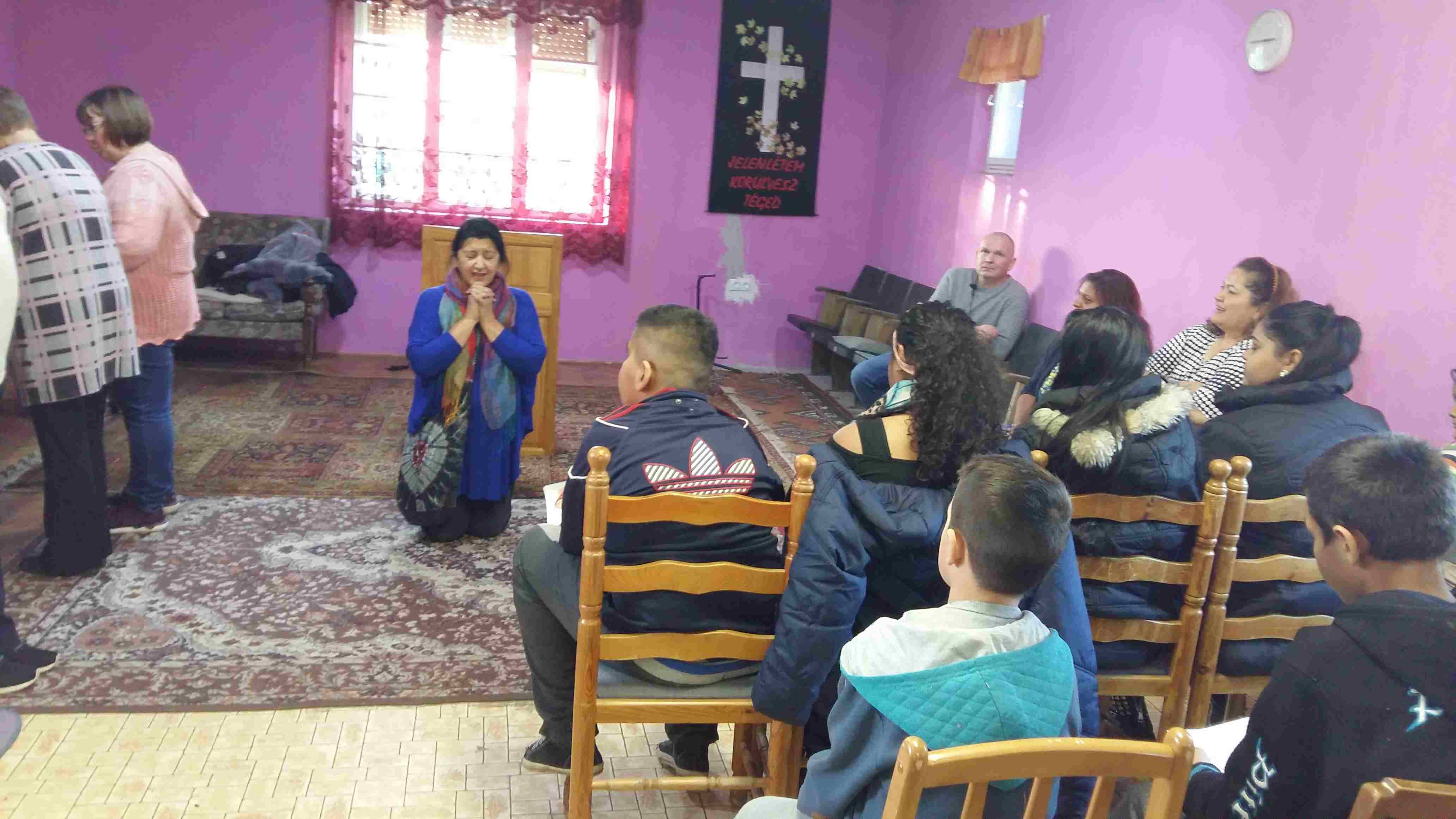 Teaching the children how to pray to Father God in Jesus
        Holy Name