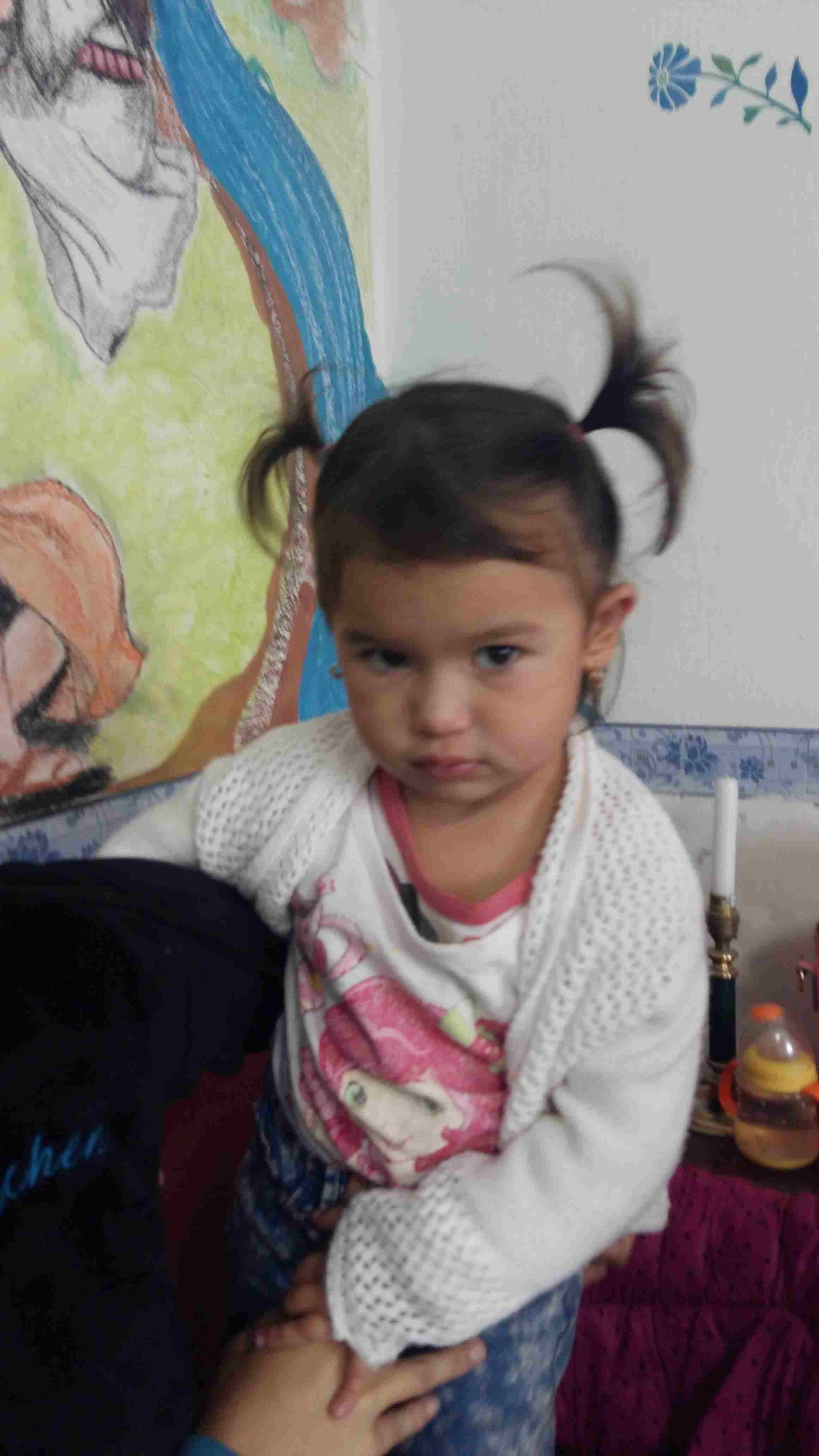 Little Dalmi recieves her gifts from UK
