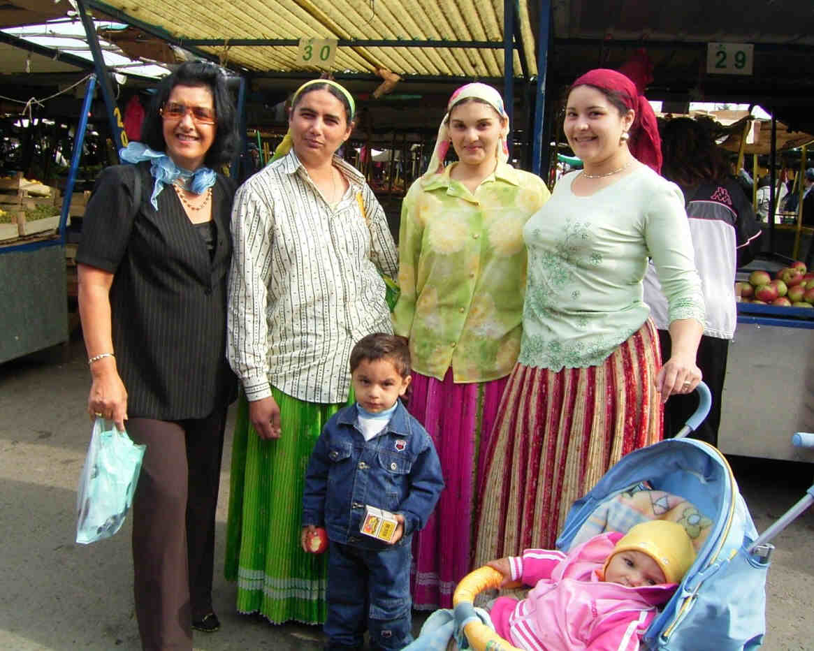 Women in bright attire
      at a market place in Panchevo near Belgrade